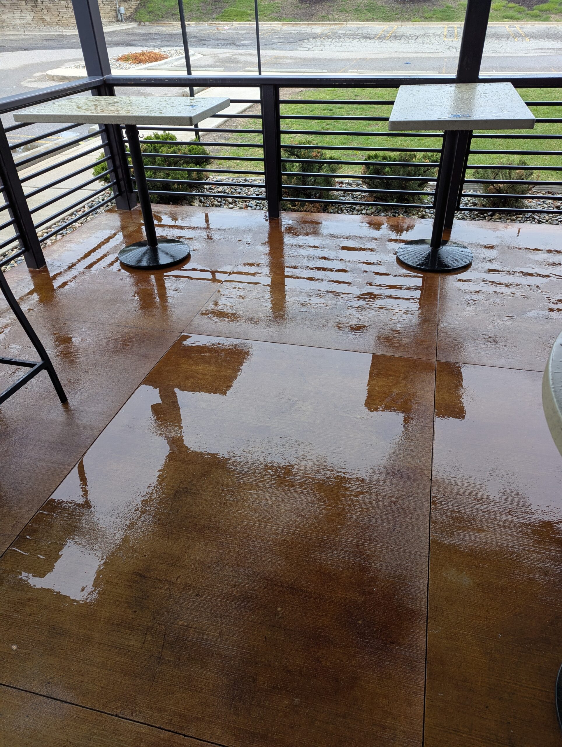 Wet paved patio surface during WashAway pressure washing