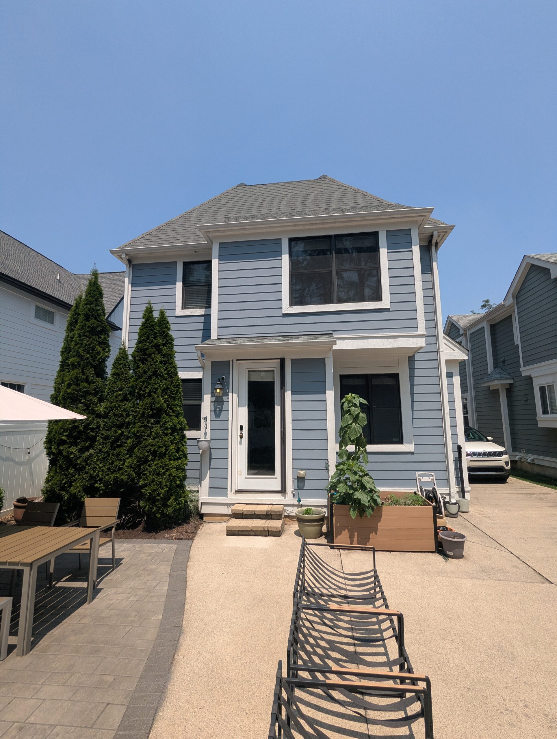 Residential home exterior with second-story windows
