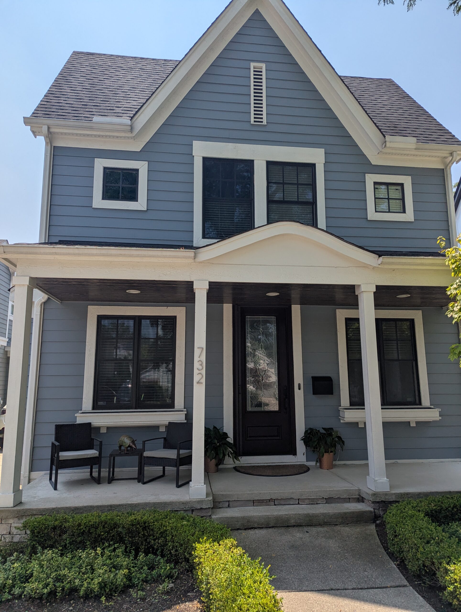 Residential home front exterior with multiple windows